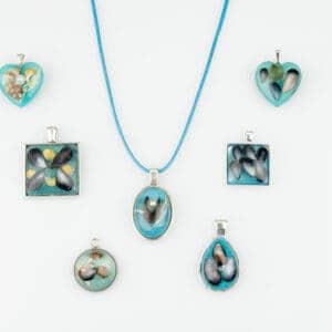 Sea blue resin beach pendants from Shetland. - Image 1