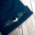 Lovely Blue Floral Oyster Catcher Embroidered Beanie With Bobble