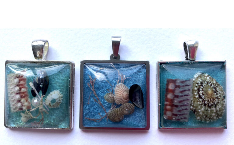 Sea blue resin beach pendants from Shetland.