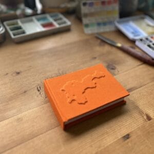 Small Embossed Tiree Watercolour Sketchbook - Orange - Image 1