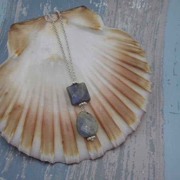 Pendant featuring two pieces of labradorite - square above oval. On silver plated chain.